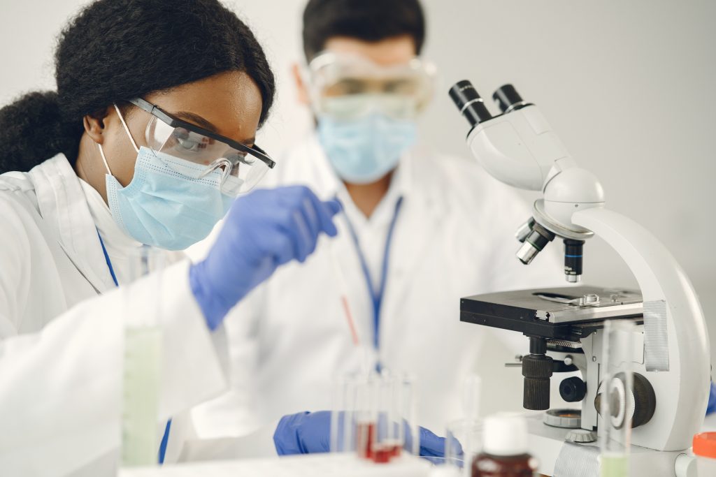 Researchers performing lab tests