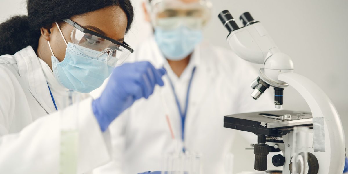 Researchers performing lab tests